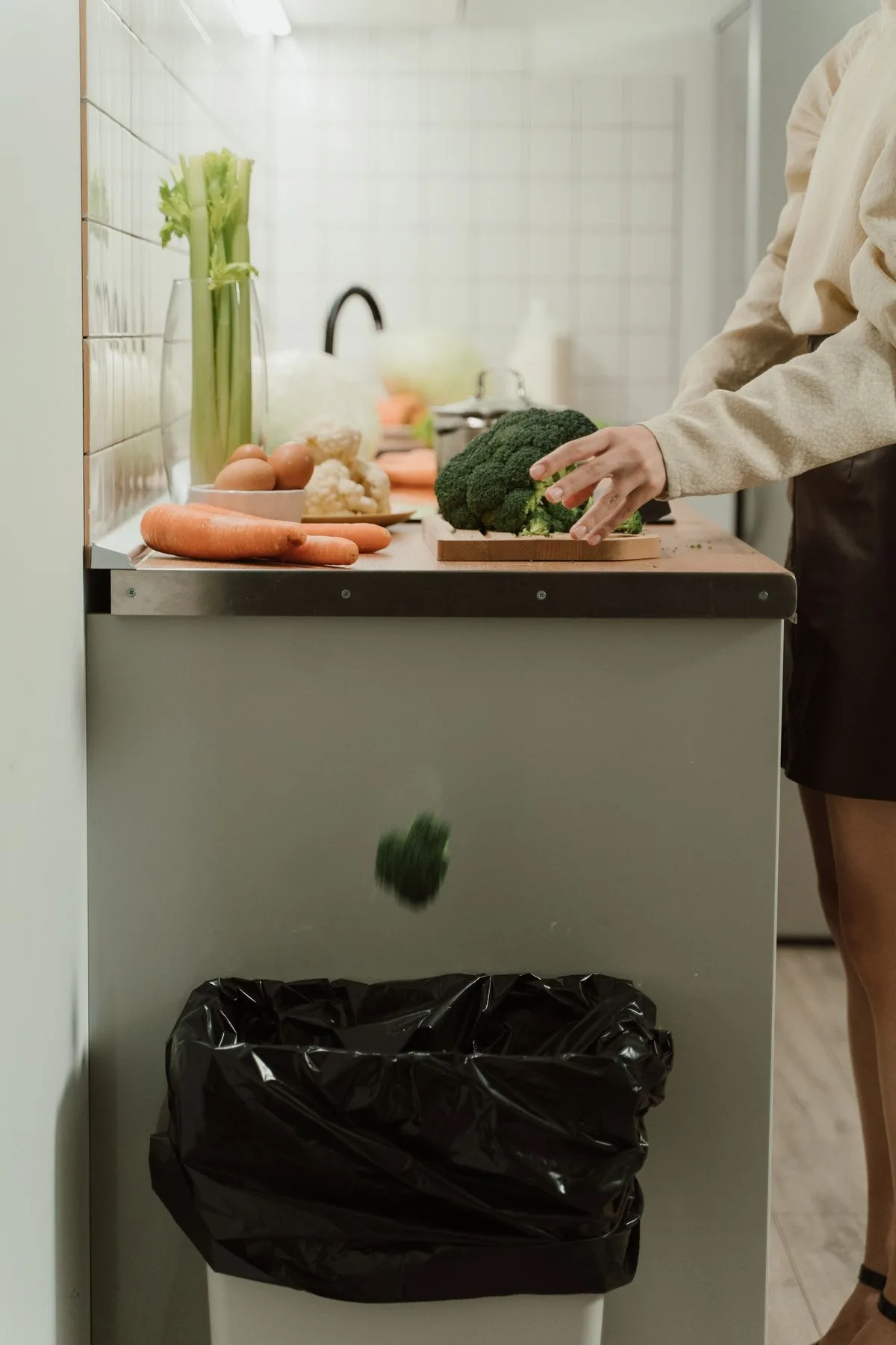 Kitchen sink with garbage disposal switch and Thanksgiving cooking prep nearby