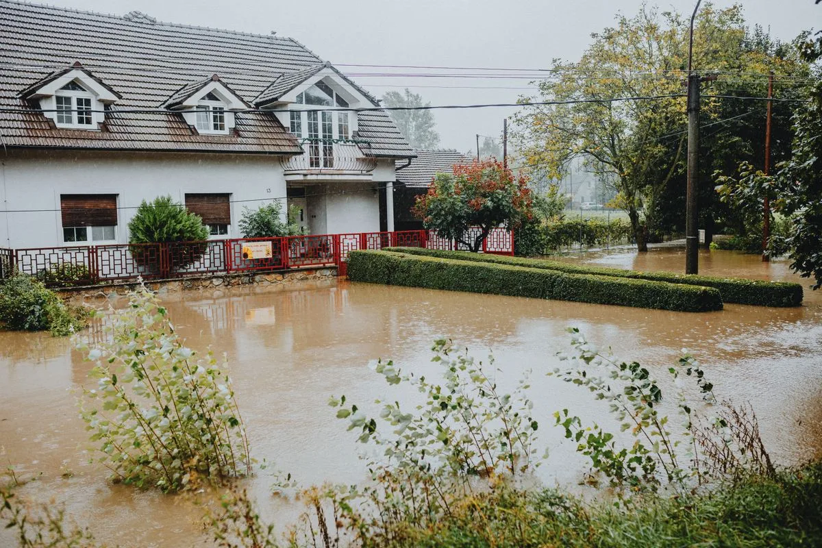 Plumber securing outdoor plumbing fixtures before a Florida hurricane